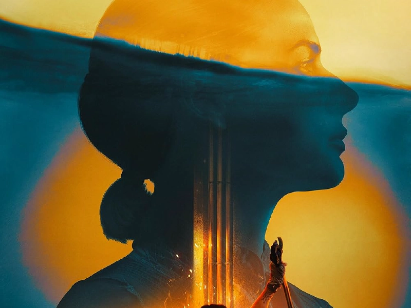 The cover art for the show Silo. Portrait of a woman over a blue and yellow background.