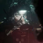 A person underwater in a scuba suit from The Last Breath