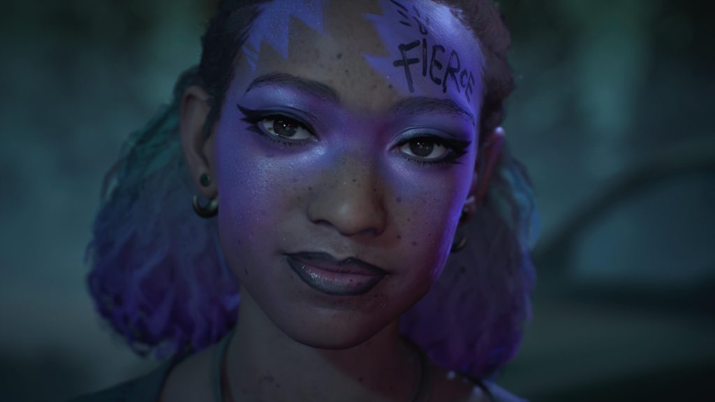 a Woman with vibrant makup and the word "Fierce" written on her forehead.