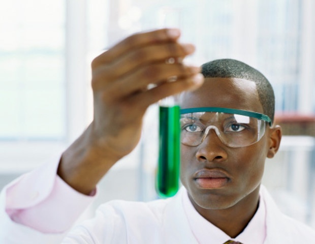 image of a man holding a beaker of green liquid. Used in memes